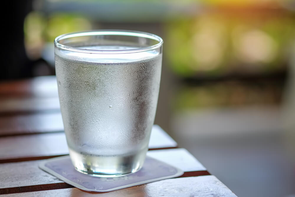 Cold Water glass on wooden table