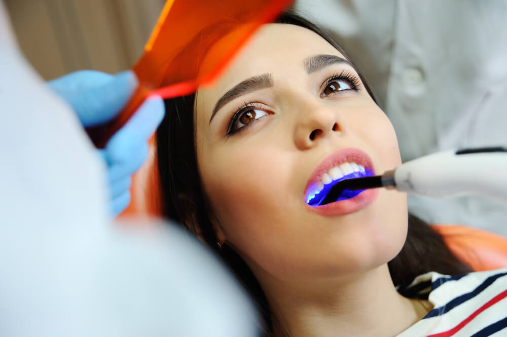 beautiful girl at the dentist. Dental fillings