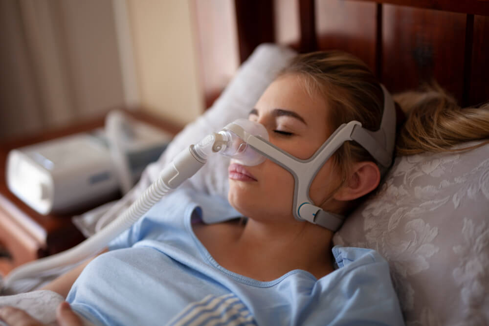 Woman using sleeping sleep apnea