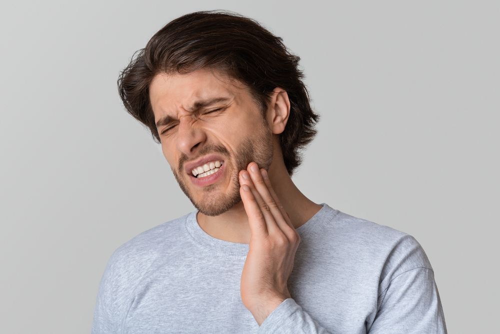man with dental emergency